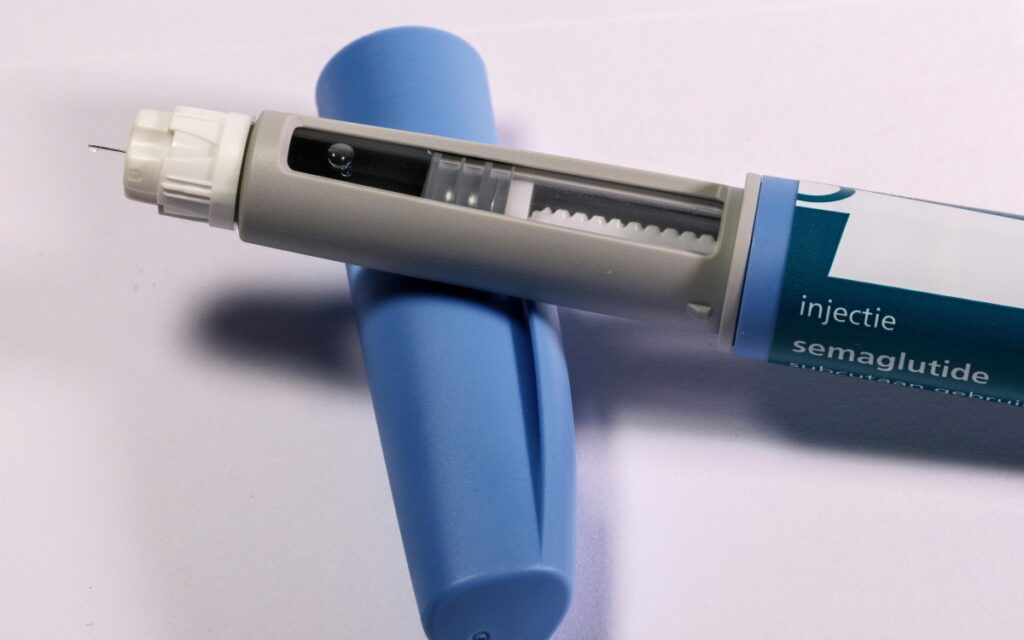 an injection pen containing the drug semaglutide, which is the active ingredient in medications like Ozempic and Wegovy.