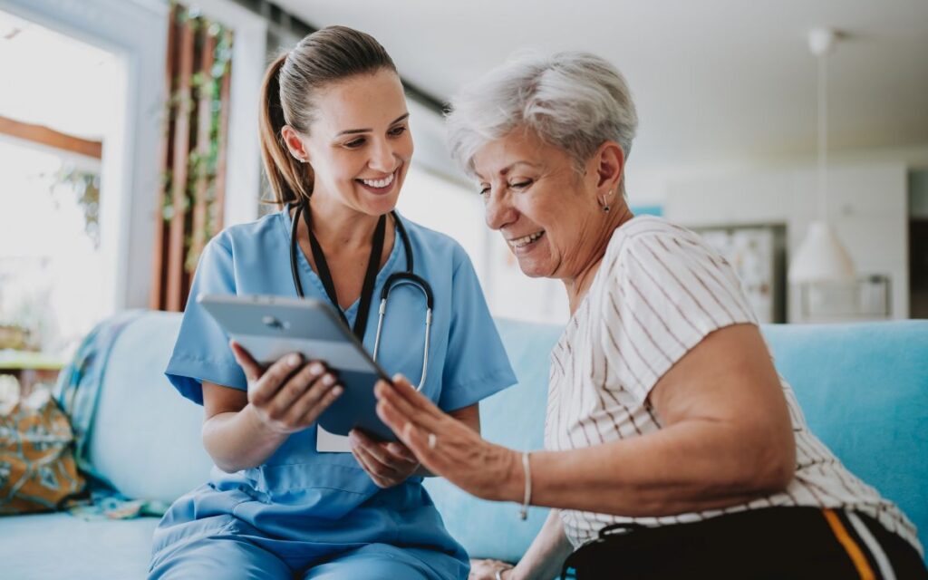 Woman using at-home diagnostics and AI-enabled detection device with a healthcare specialist.